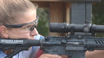 Up In Arms / Woman shooting